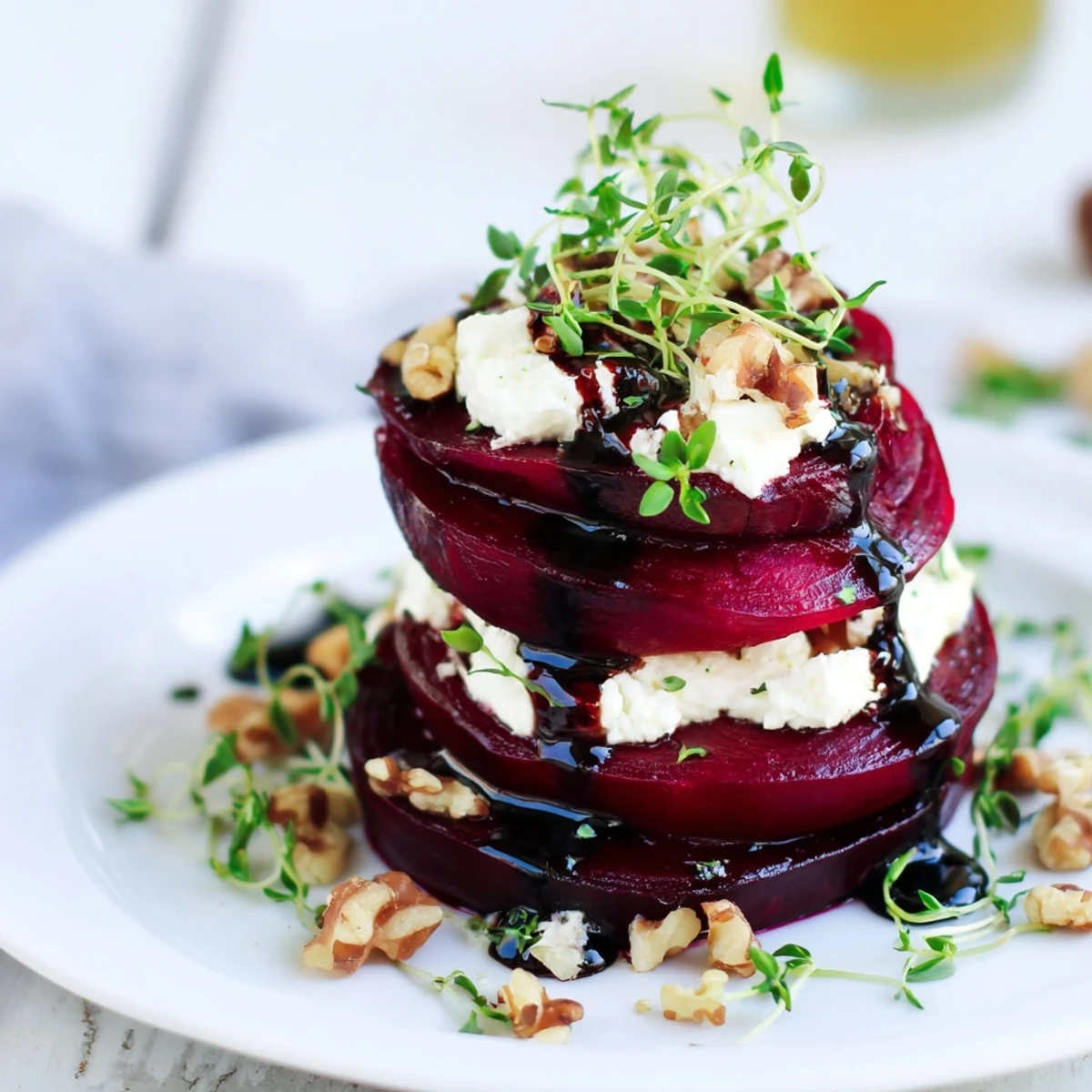 This colorful Roasted Beet and Goat Cheese Stack presents beet slices with creamy goat cheese, ready to eat.