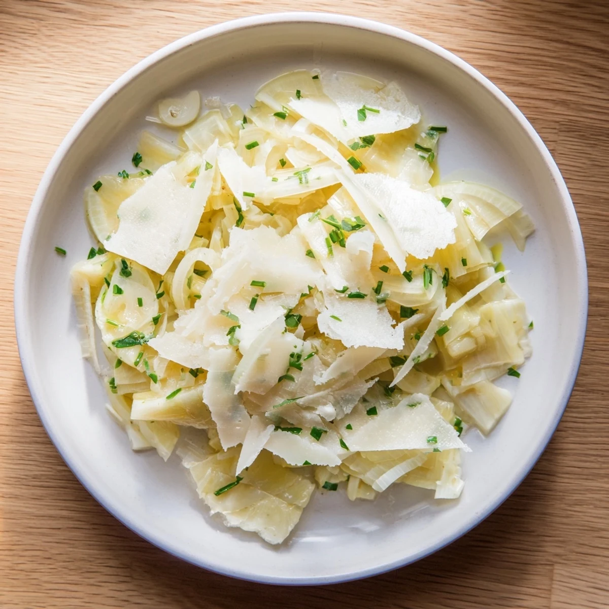 Golden-brown braised fennel with Parmesan, a classic Italian side dish, beautifully plated and ready to serve.