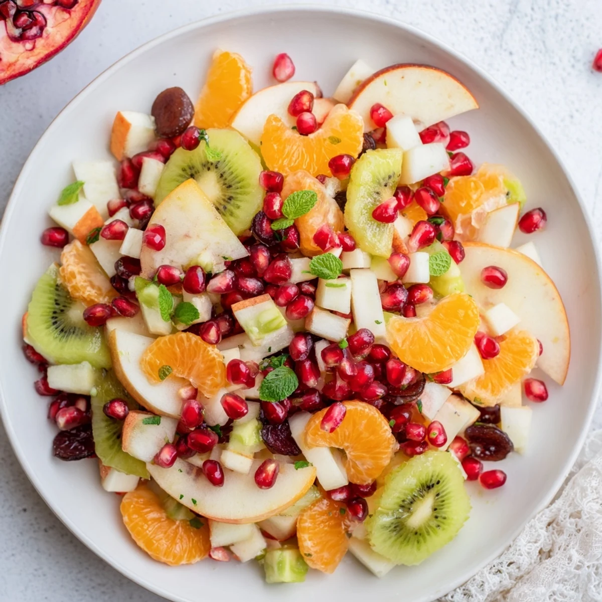 This colorful Winter Fruit Salad with Honey Lime Dressing shows a beautifully arranged fruit bowl, ready to serve.