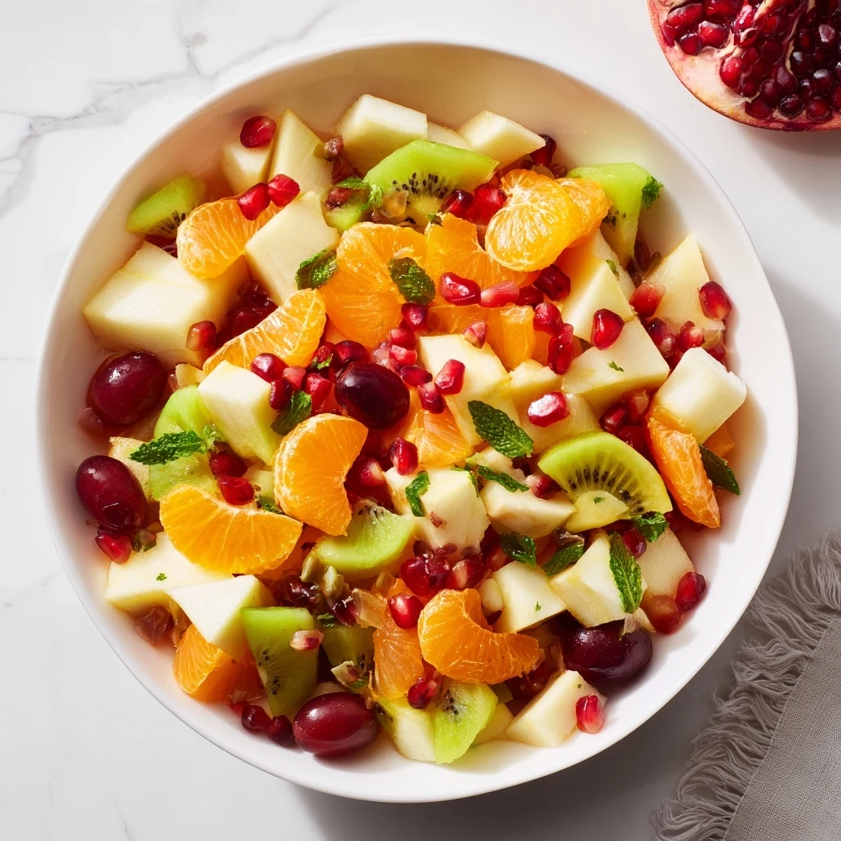 Tempting view: Fresh Winter Fruit Salad with Honey Lime Dressing drizzled for a sweet and tangy bite.