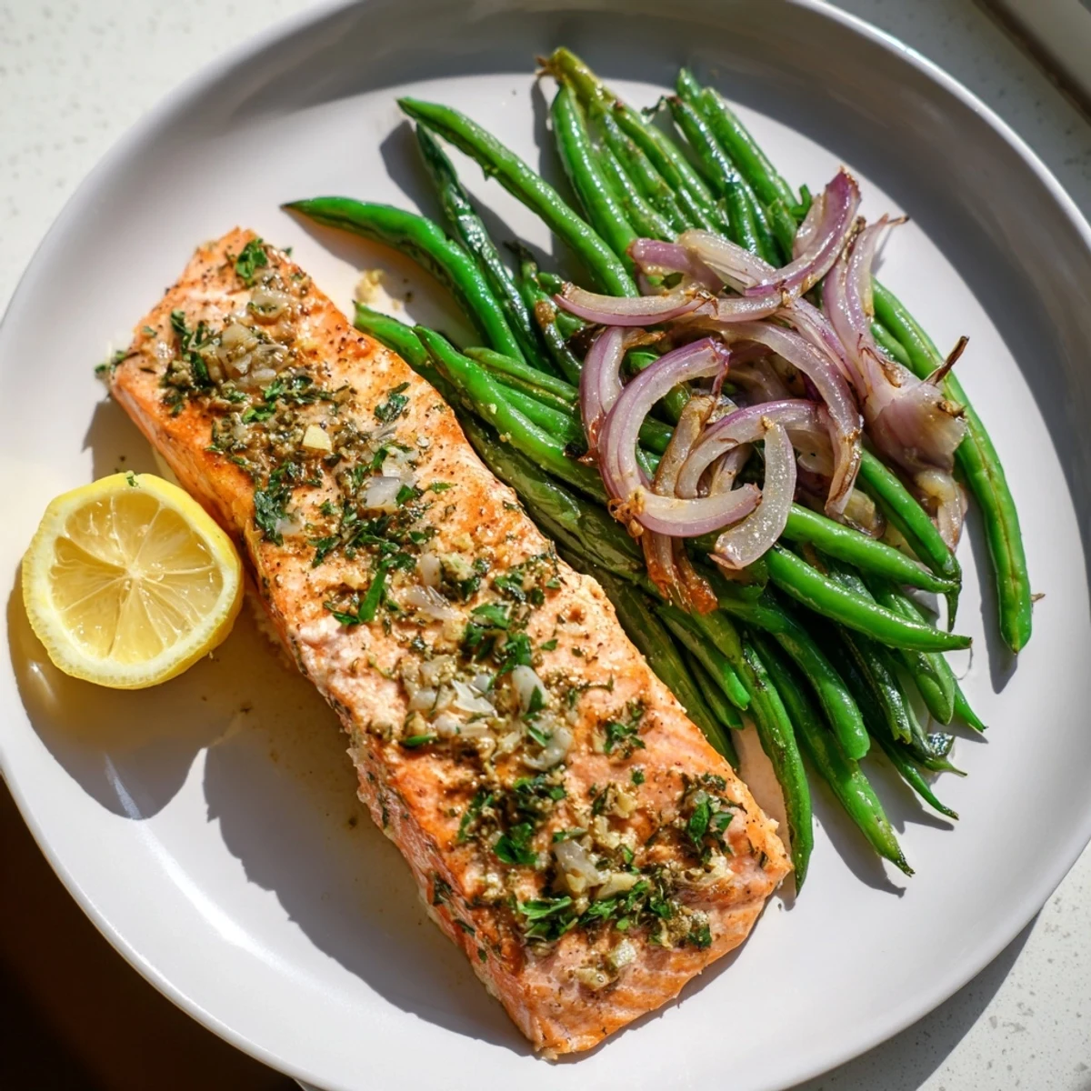 Flaky sheet pan salmon and green beans with roasted vegetables, a healthy one-pan dinner.
