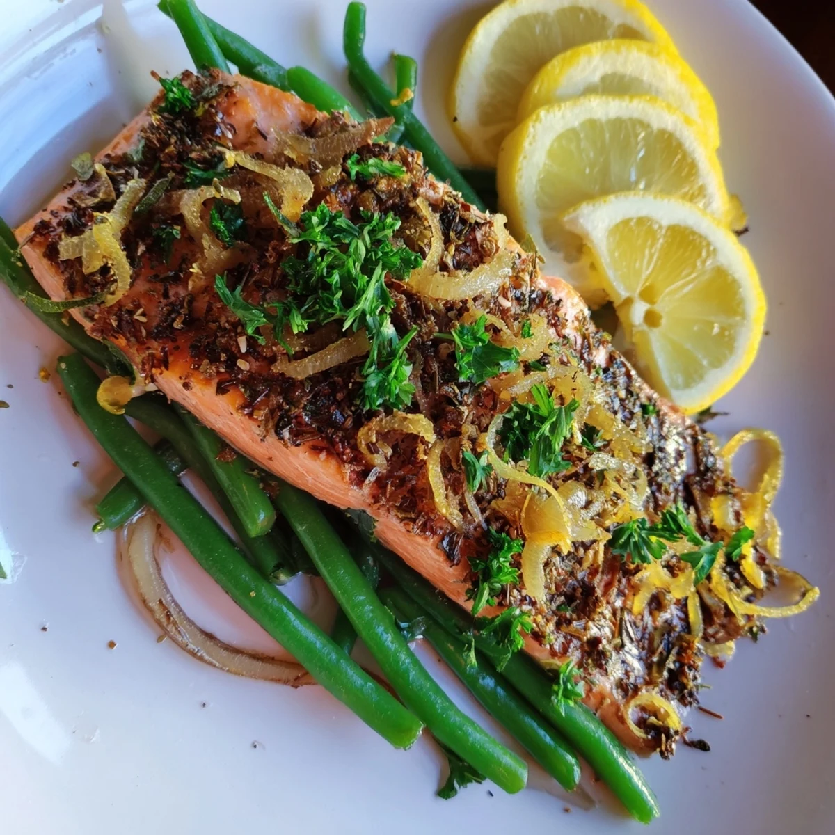 Golden sheet pan salmon, tender green beans, and lemon, a simple, delicious American recipe.