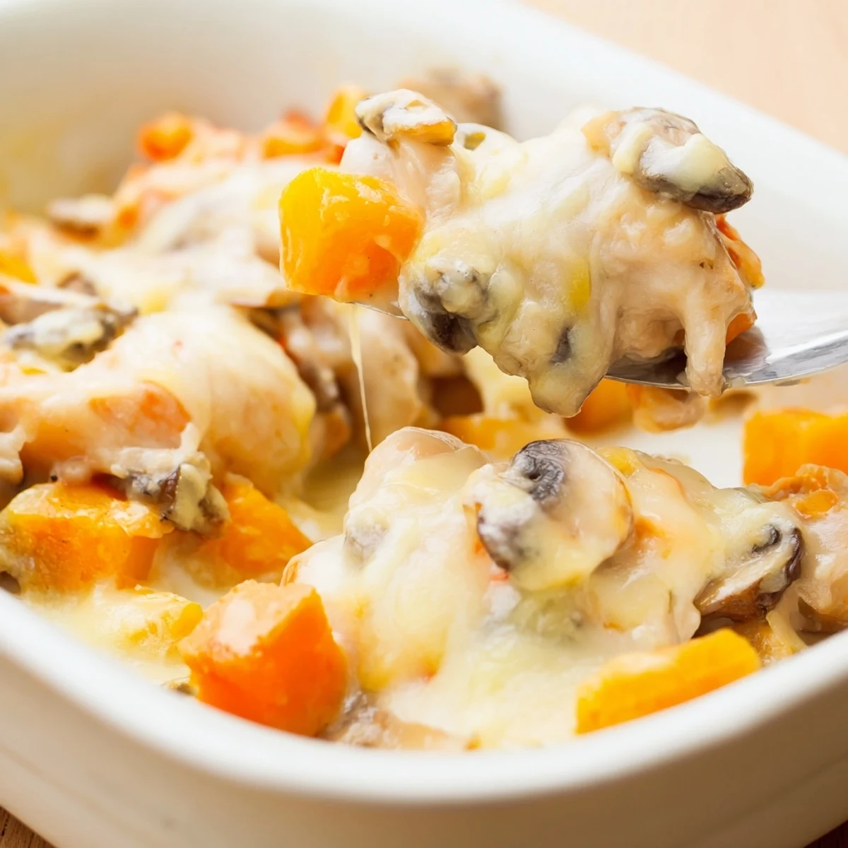 Fresh parsley tops a hearty casserole with winter vegetables, served for cozy family dinners.