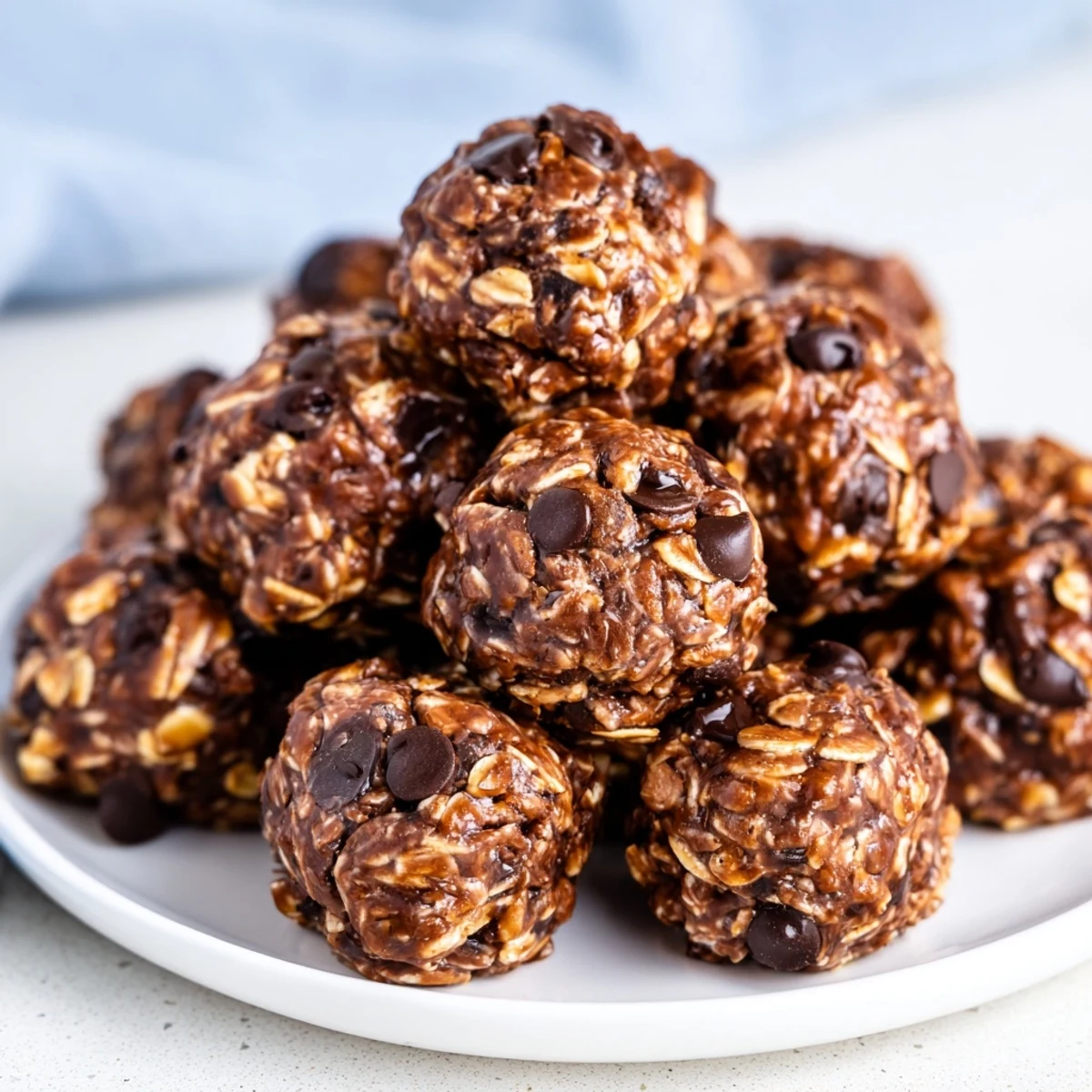Chilled Chocolate Peanut Butter Energy Balls sit on a cooling rack, ready for a busy morning or afternoon treat.