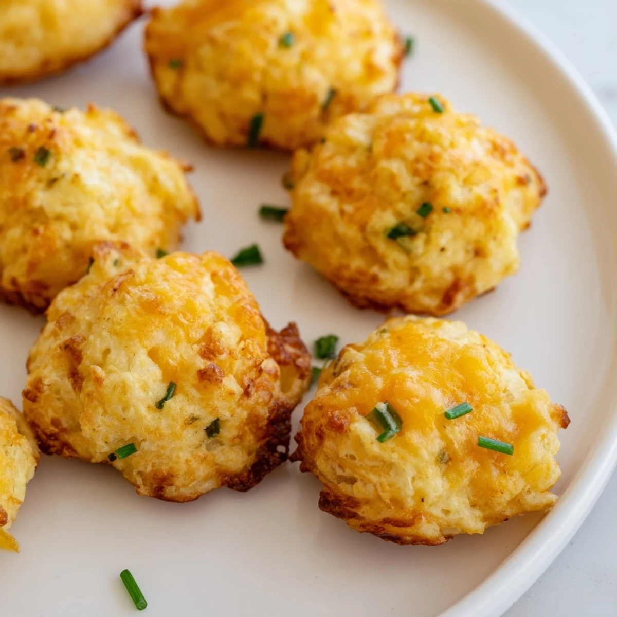 Crispy Mashed Potato Cheese Puffs with melted cheddar and fresh green chives
