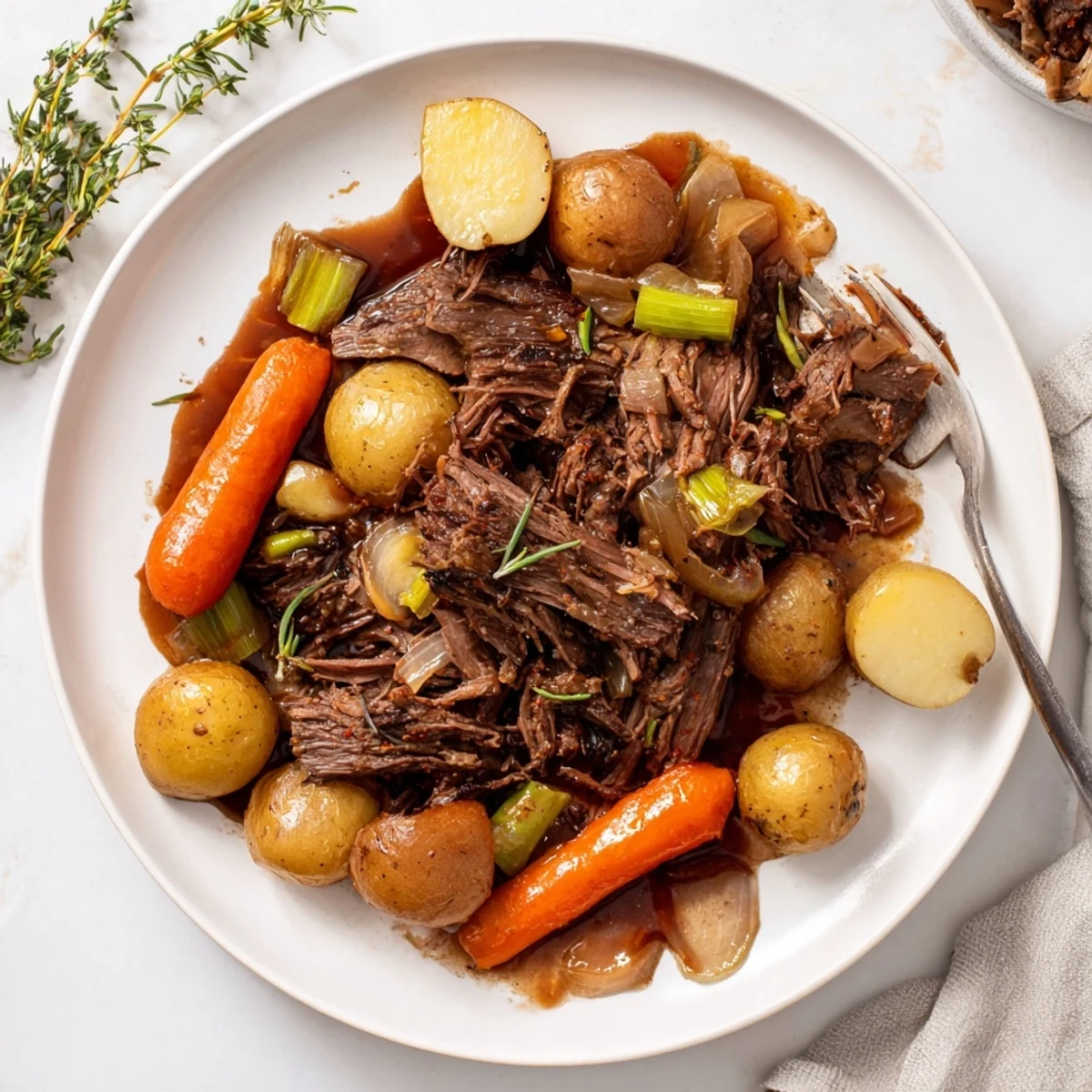 Savory beef chuck roast slowly braised with fresh herbs for meltingly tender comfort food
