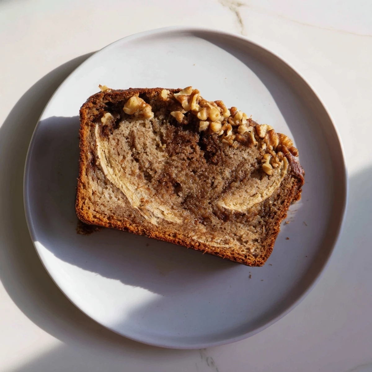Moist banana nut bread with crunchy walnuts baked into a cinnamon sugar marble