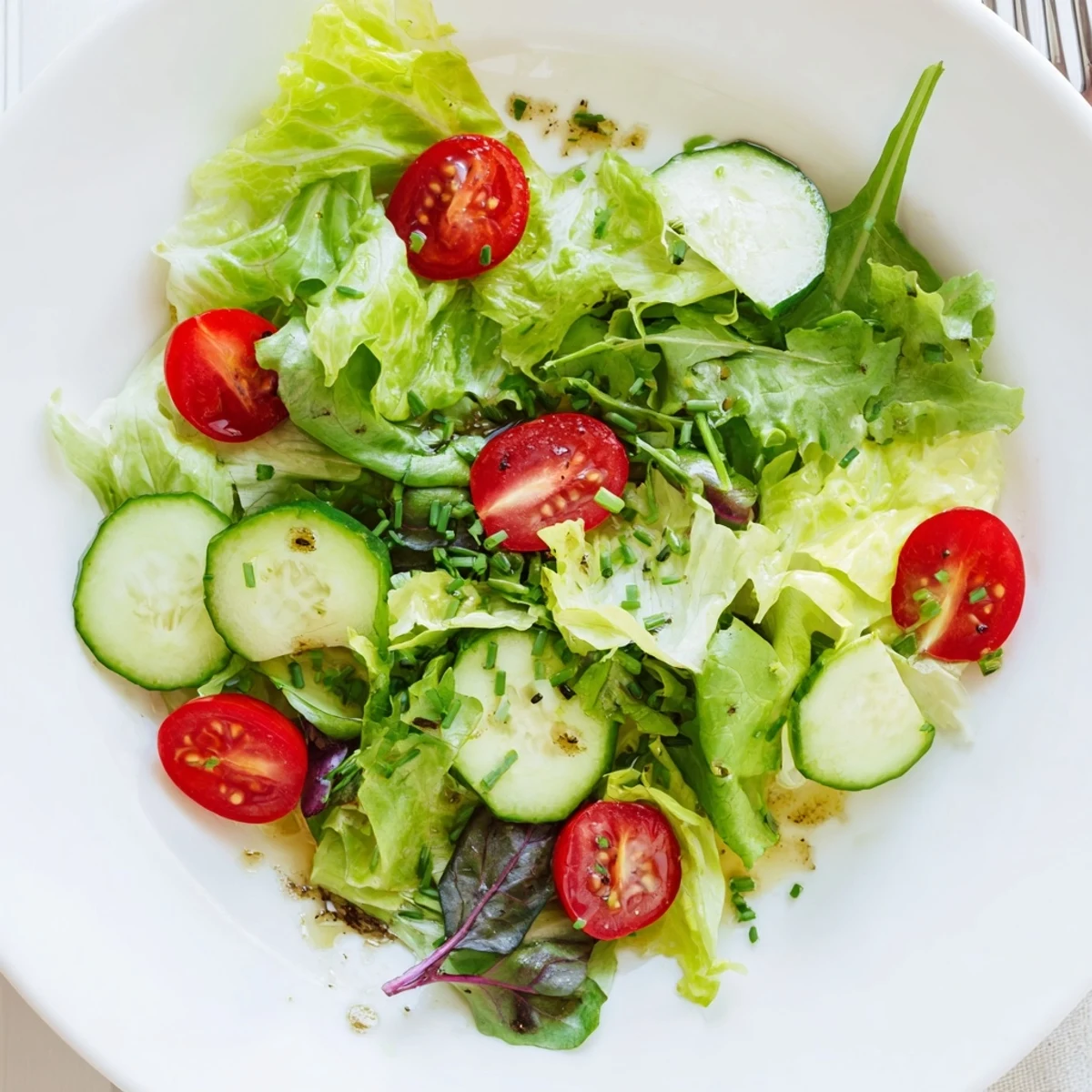Simple Green Salad Recipe with crisp romaine, juicy tomatoes, lemon vinaigrette drizzle