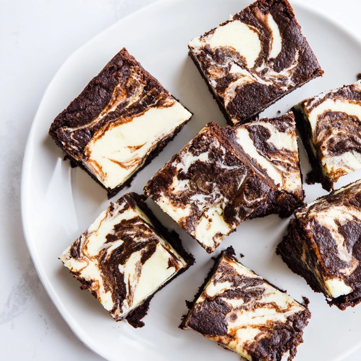Fudgy sourdough cheesecake brownie bars swirled with tangy cream cheese and rich chocolate layers