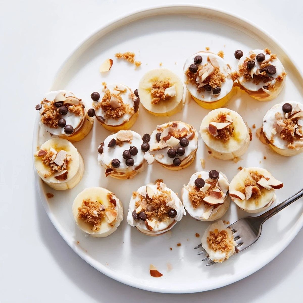 Hand picking Frozen Banana Yogurt Bites from freezer, tangy yogurt and sweet banana