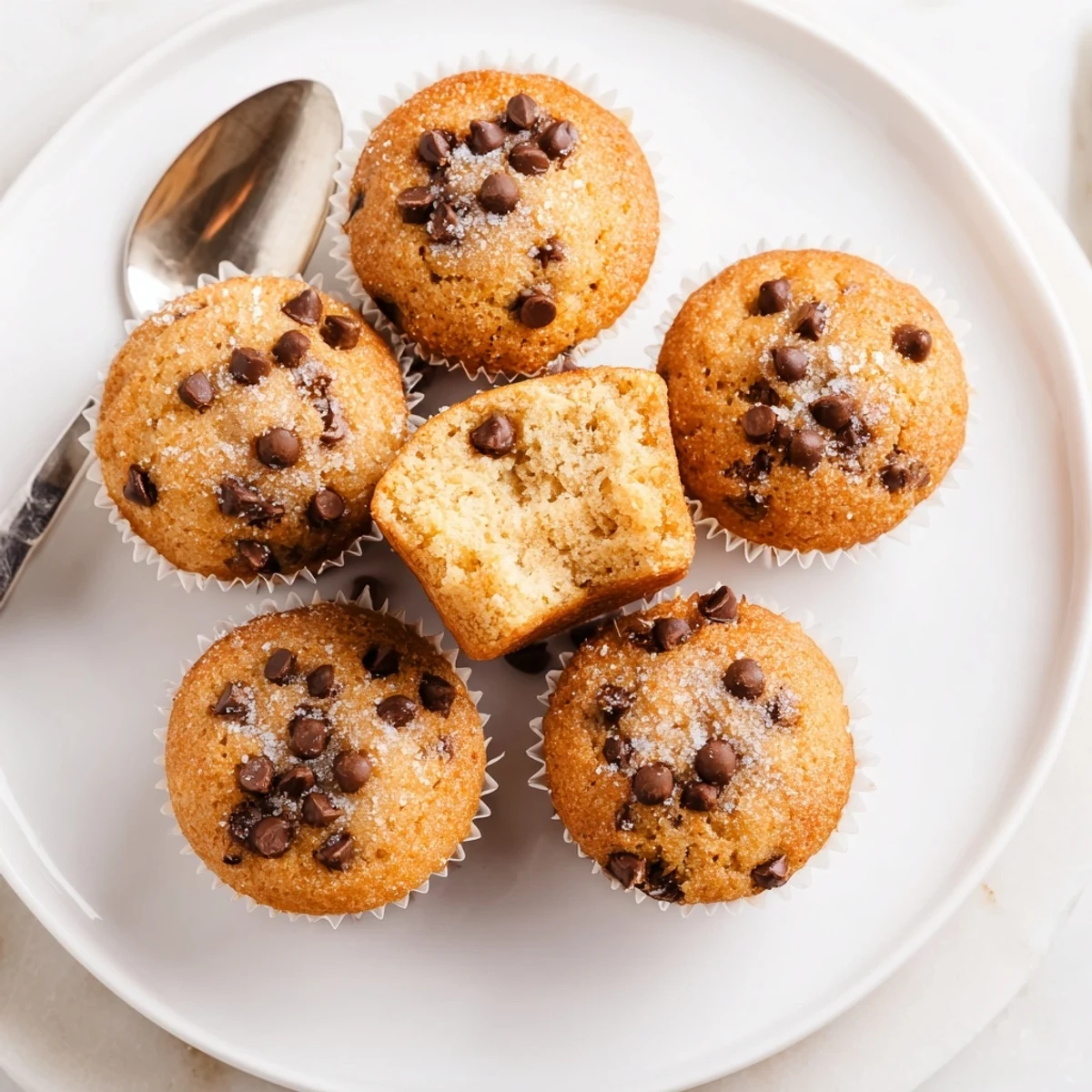 Little Bites Mini Muffins tucked into lunchboxes beside fruit for snacking