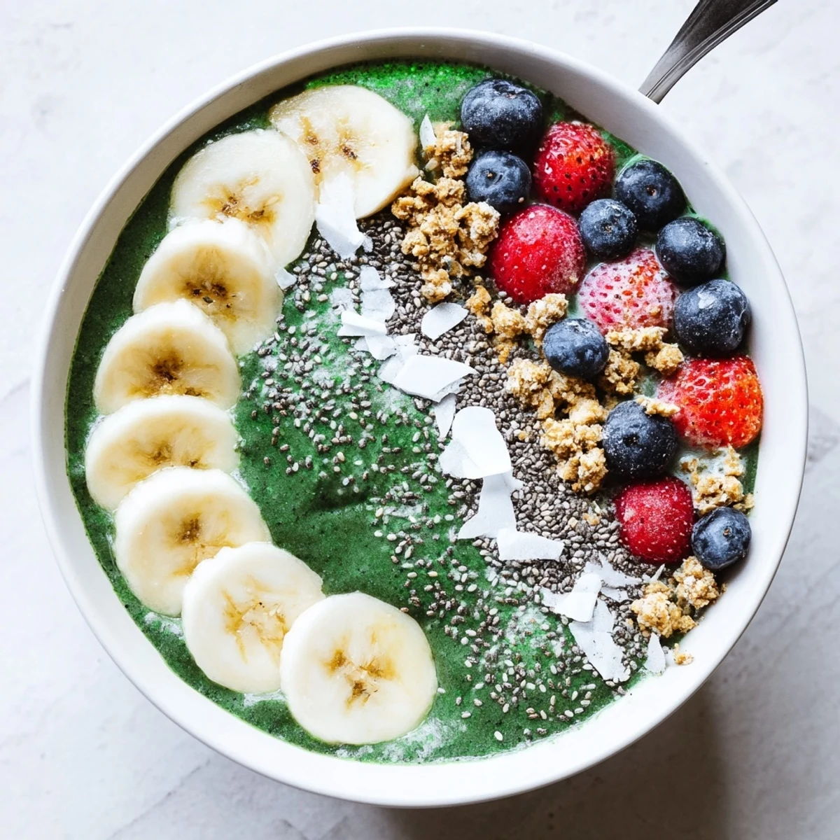Creamy Green Smoothie Bowl with Spirulina, Banana & Hemp Seeds served cold