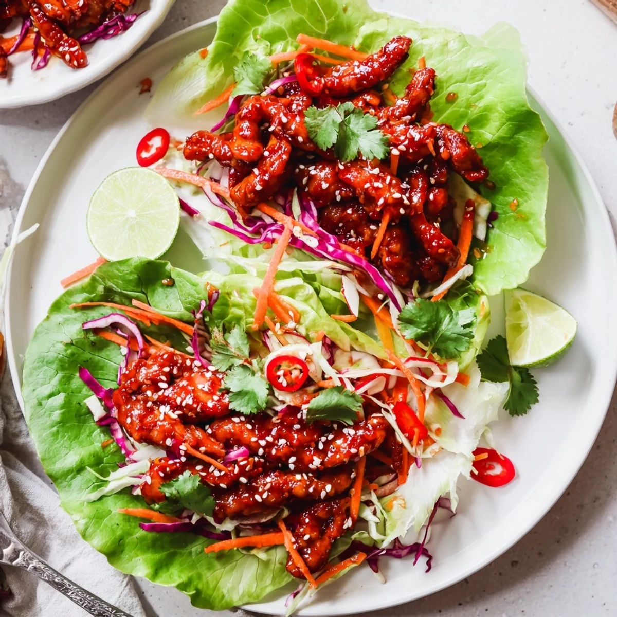 Smoky-spicy chicken, crunchy radish, lime in Fiery Korean Chicken Lettuce Wraps With Crunchy Slaw