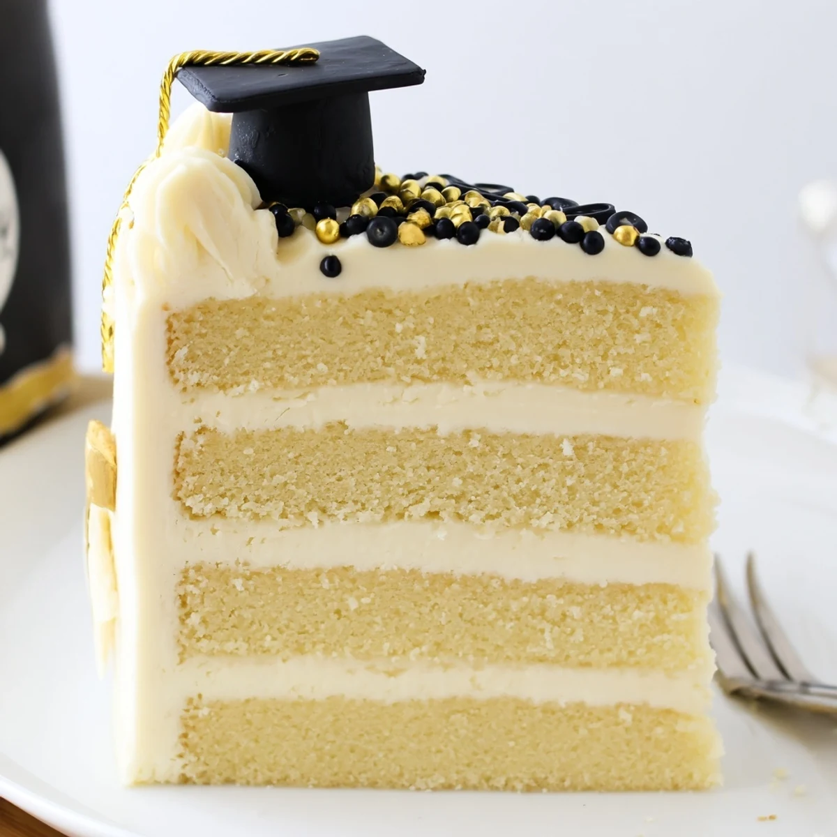 Graduation Cake Recipe with moist vanilla layers, creamy buttercream, gold sprinkles.
