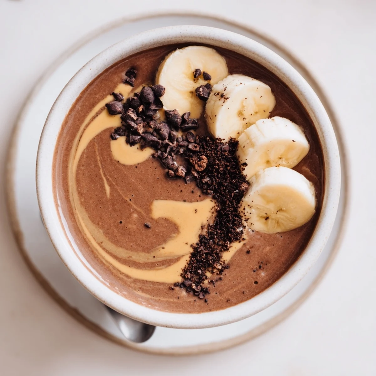 Post-workout Chocolate Peanut Butter Protein Smoothie served cold with ice, thick texture