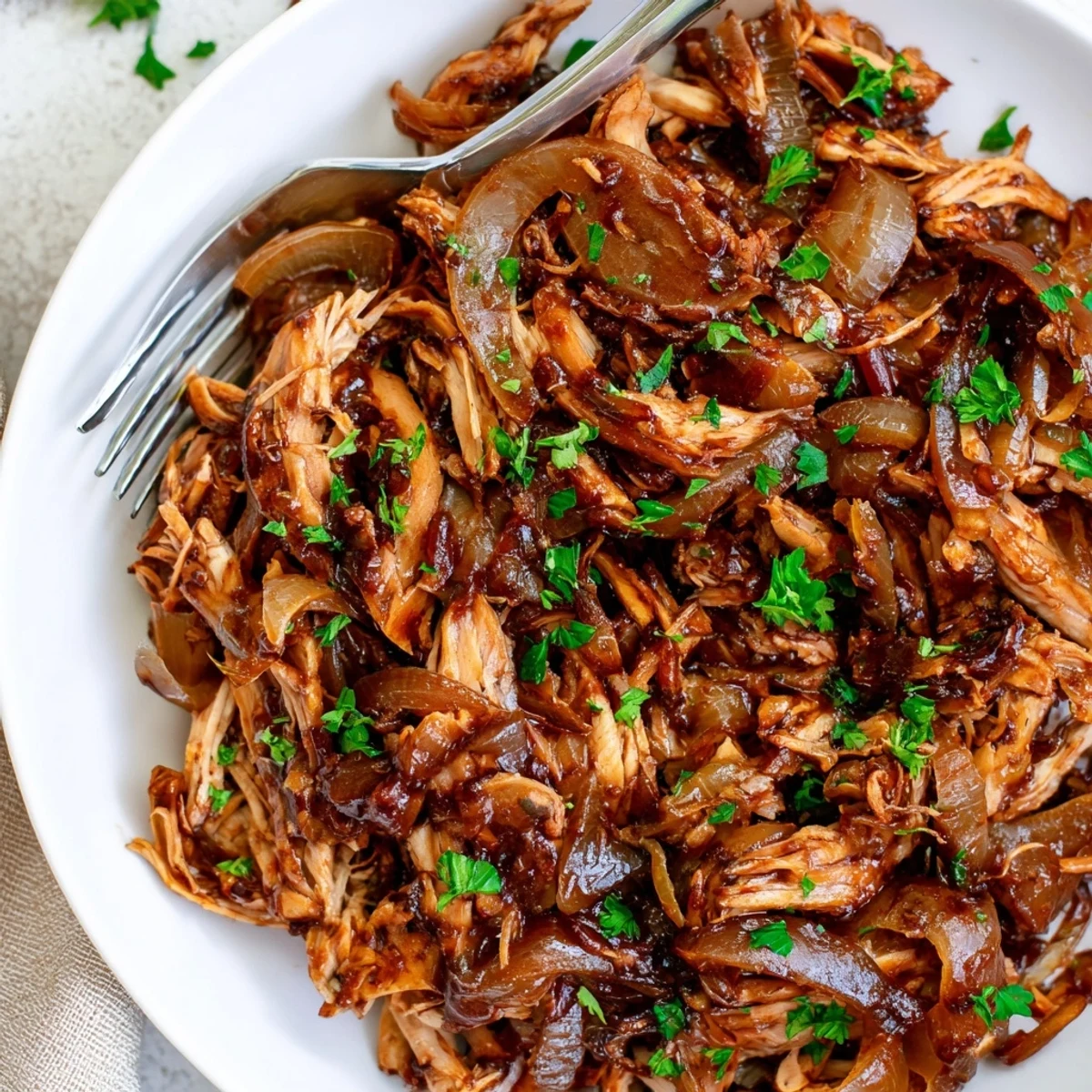 Juicy Slow Cooker Balsamic Chicken drizzled with a glossy, tangy-sweet sauce