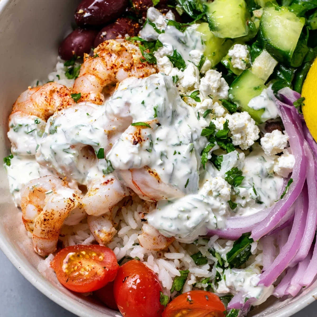 Juicy Greek Shrimp Mediterranean Bowl served over lemony rice with cool tzatziki sauce