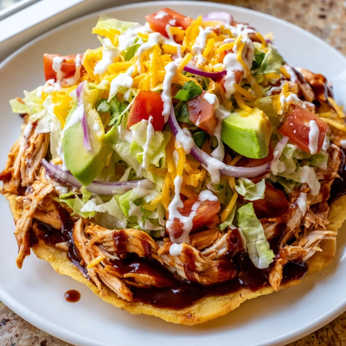 Golden tostada shells piled high with tender sweet smoky BBQ chicken and colorful veggie toppings