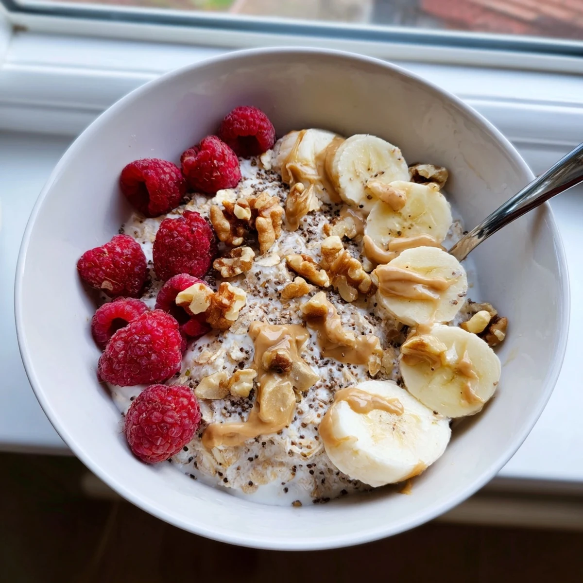 Velvety protein overnight oats layered with Greek yogurt and a sprinkle of chia seeds