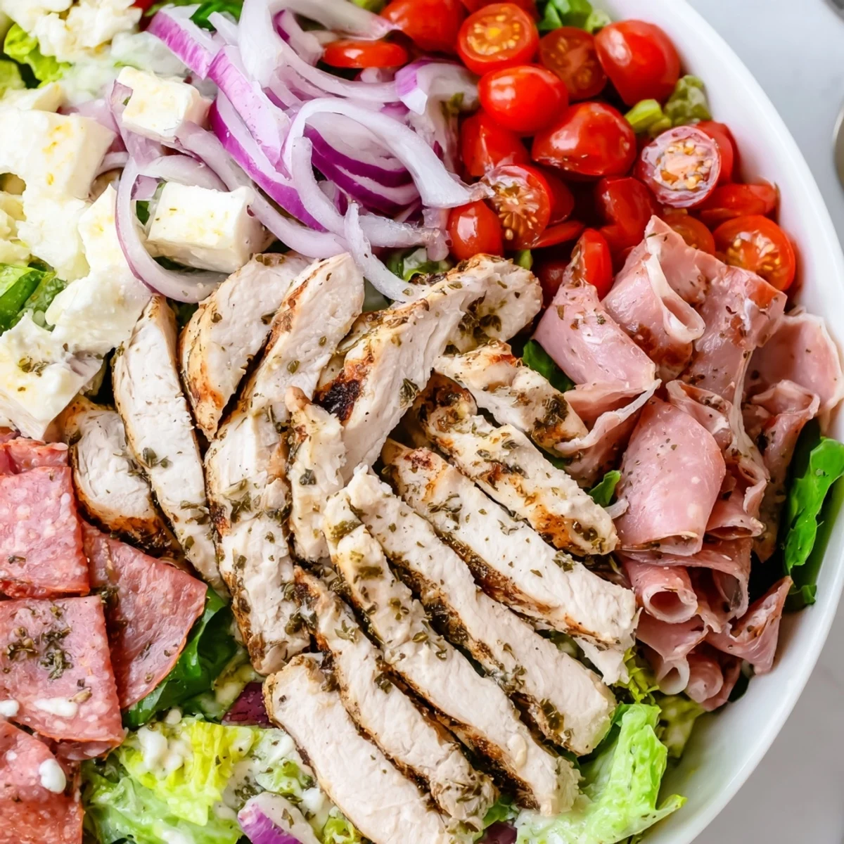 Juicy grilled chicken tops this Italian Grinder Chicken Salad with pepperoncini and roasted peppers