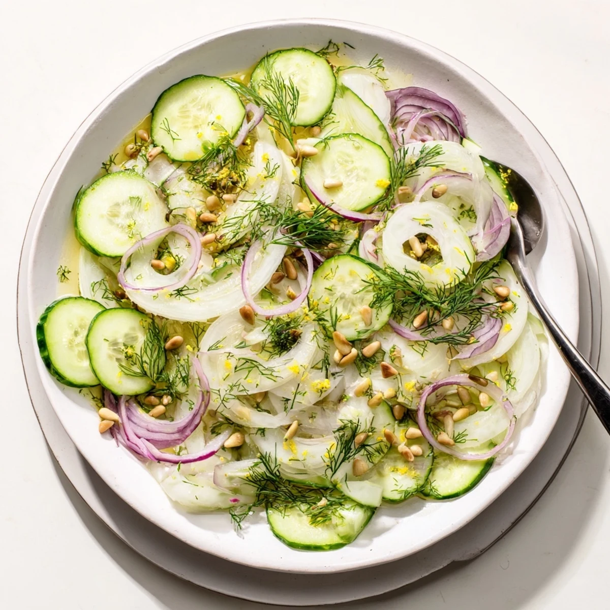 Vibrant crisp fennel cucumber salad topped with fresh dill and zesty citrus dressing  
