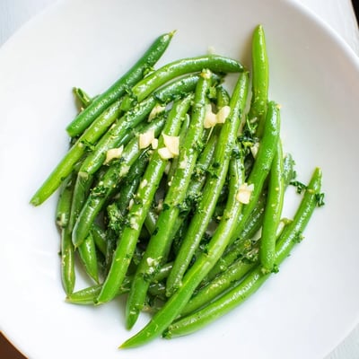 Picture the tender Garlic Butter Green Beans: bright green, coated in glistening garlic butter.